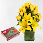 Exotic Arrangement Of Yellow Lilies With Yellow Roses With Half Kg Badam Halwa From Haldiram