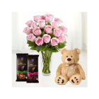 12 PINK ROSES IN GLASS VASE WITH 6 INCH BROWN TEDDY BEAR WITH 2 BOURNVILLE CHOCOLATE