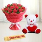 BOUQUET OF 10 RED CARNATIONS WITH 6 INCH TEDDY BEAR AND TOBLERONE CHOCOLATE