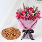 BUNCH OF PINK LILIES WITH PINK ROSES WITH BASKET OF HALF KG ALMONDS