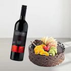 MIX FRUIT CAKE WITH BOTTLE OF RED WINE